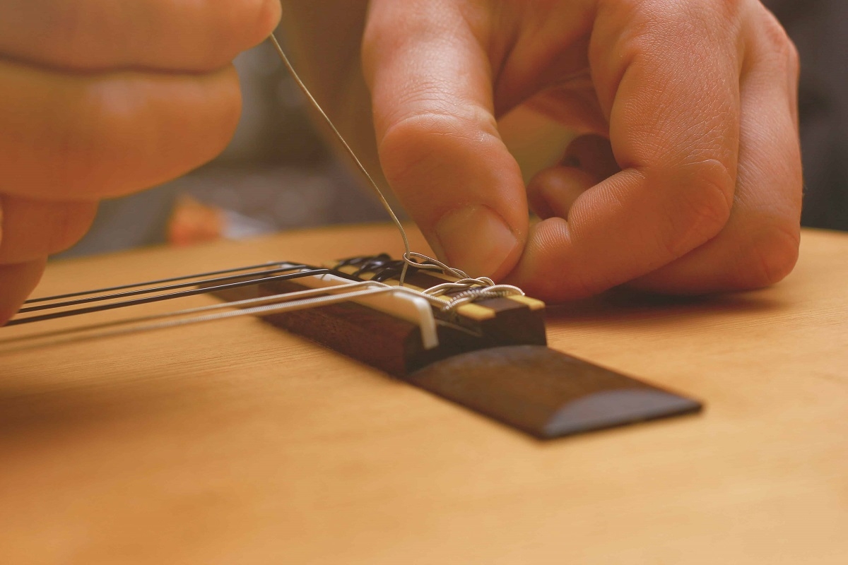 Gitaar Laten Repareren - gitaarreparatie-gitaarreparatie-johdeheer-klassieke_brug